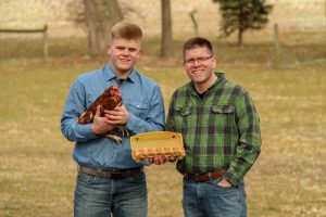 George Weaver IV and George Weaver III with Nature's Yoke New Plastic Free Post-Consumer Paper Carton